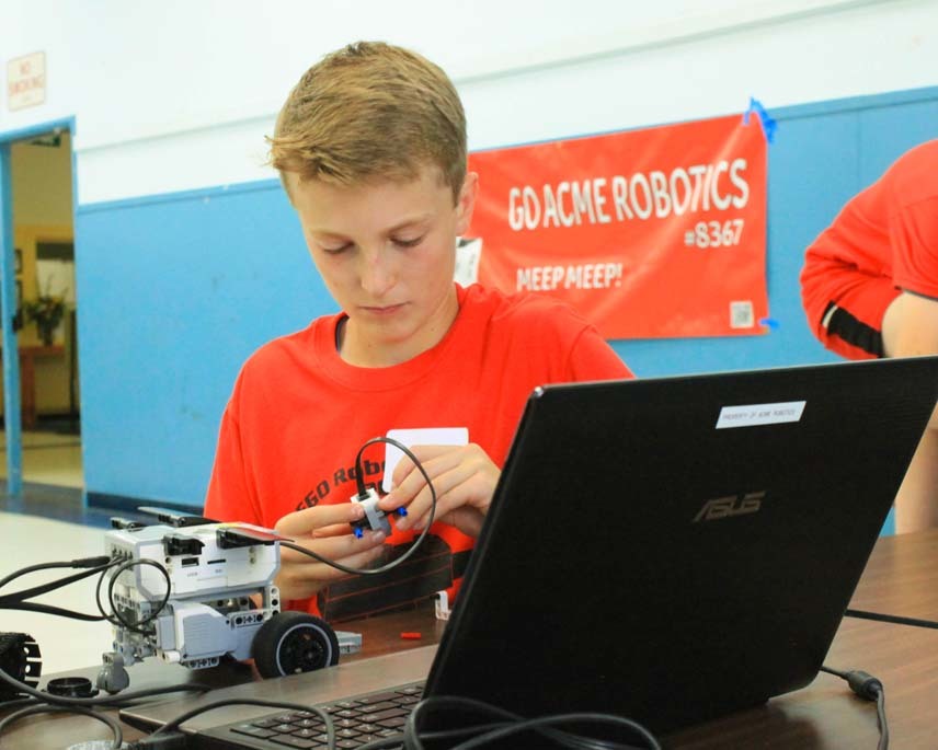 boy programming robot
