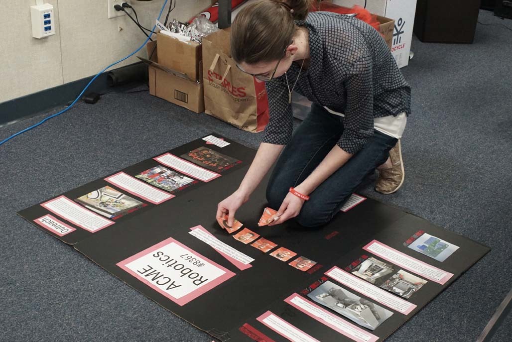 Team member making project board
