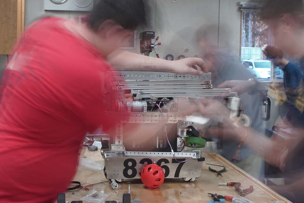 team members building robot